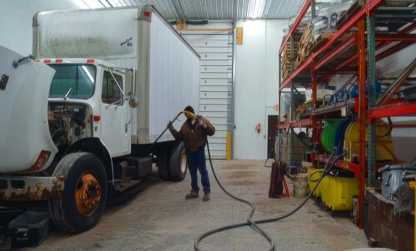 Adelman's employee cleaning truck